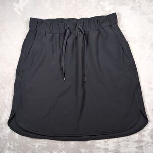 Lululemon On The Fly Skirt Womens 12 Black Travel Commute Athleisure Pickleball